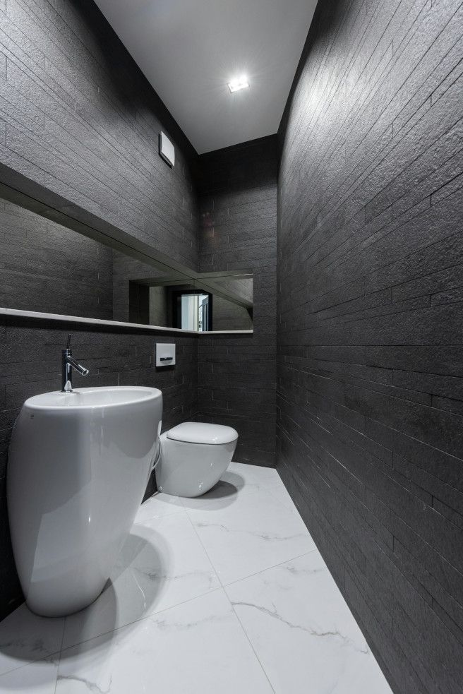 Luxury bathroom with detailed tile work in Swansea.